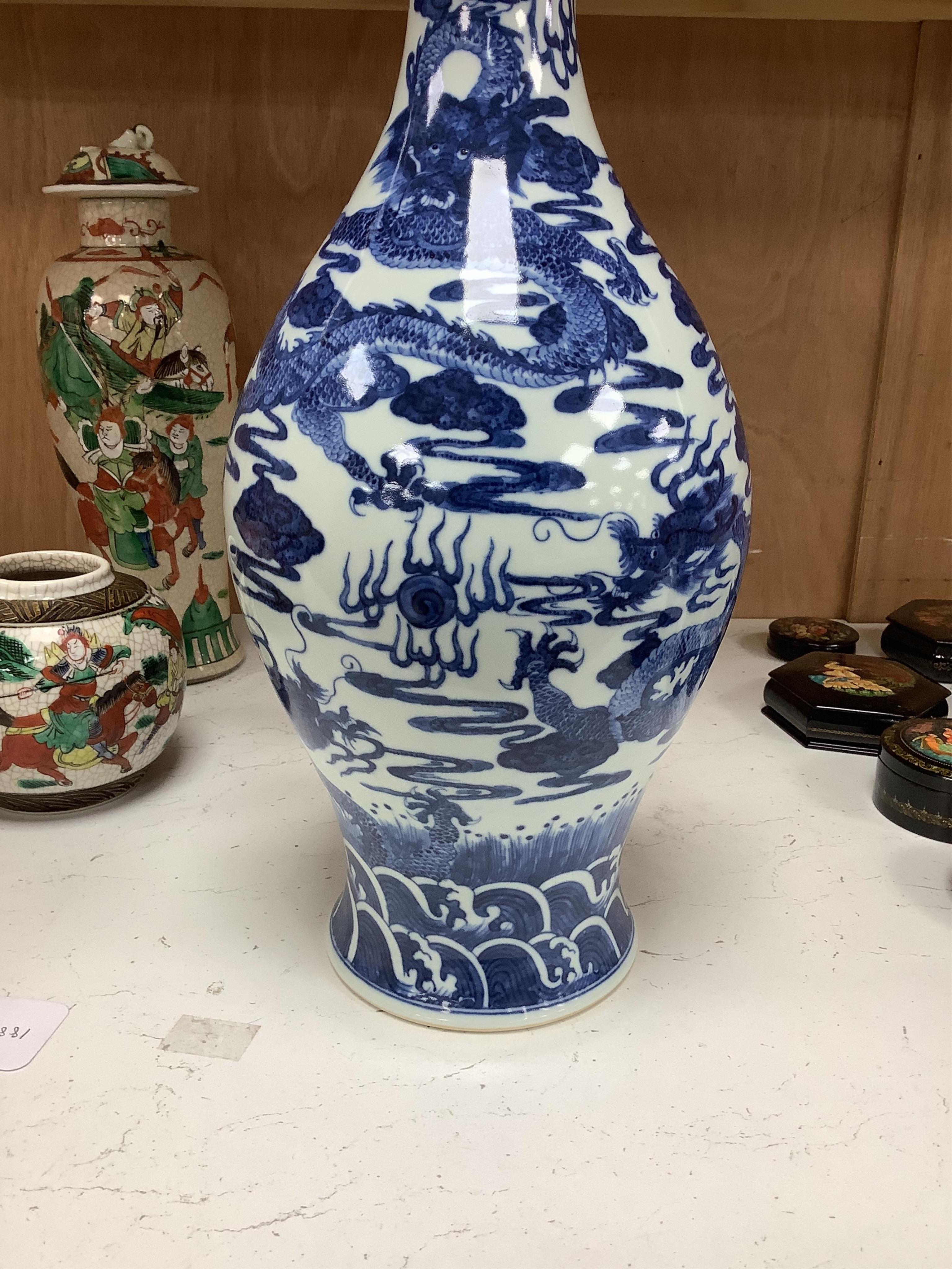 A large Chinese blue and white dragon vase, 40 cm high.